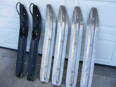 Production 295s skis next to blanks