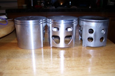 Left; stock double ring piston. Center; my own creation. Right; used single ring with &quot;recommended&quot; boost ports.