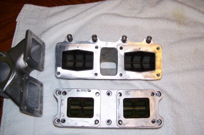 Top is the Goki, it uses the reeds, cages and intakes from a Jetski 650. Bottom is the Johnny O's using banshee reeds and cages. Intake pictured is for a vertically mounted SBN44 Mikuni diaphragm type marine carburetor.