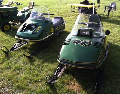 A couple of nice original sleds on display with some lawn tractors outside.